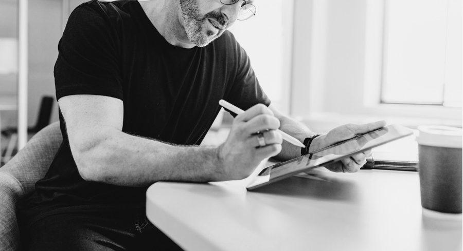 A footwear founder sketching ideas for their brand